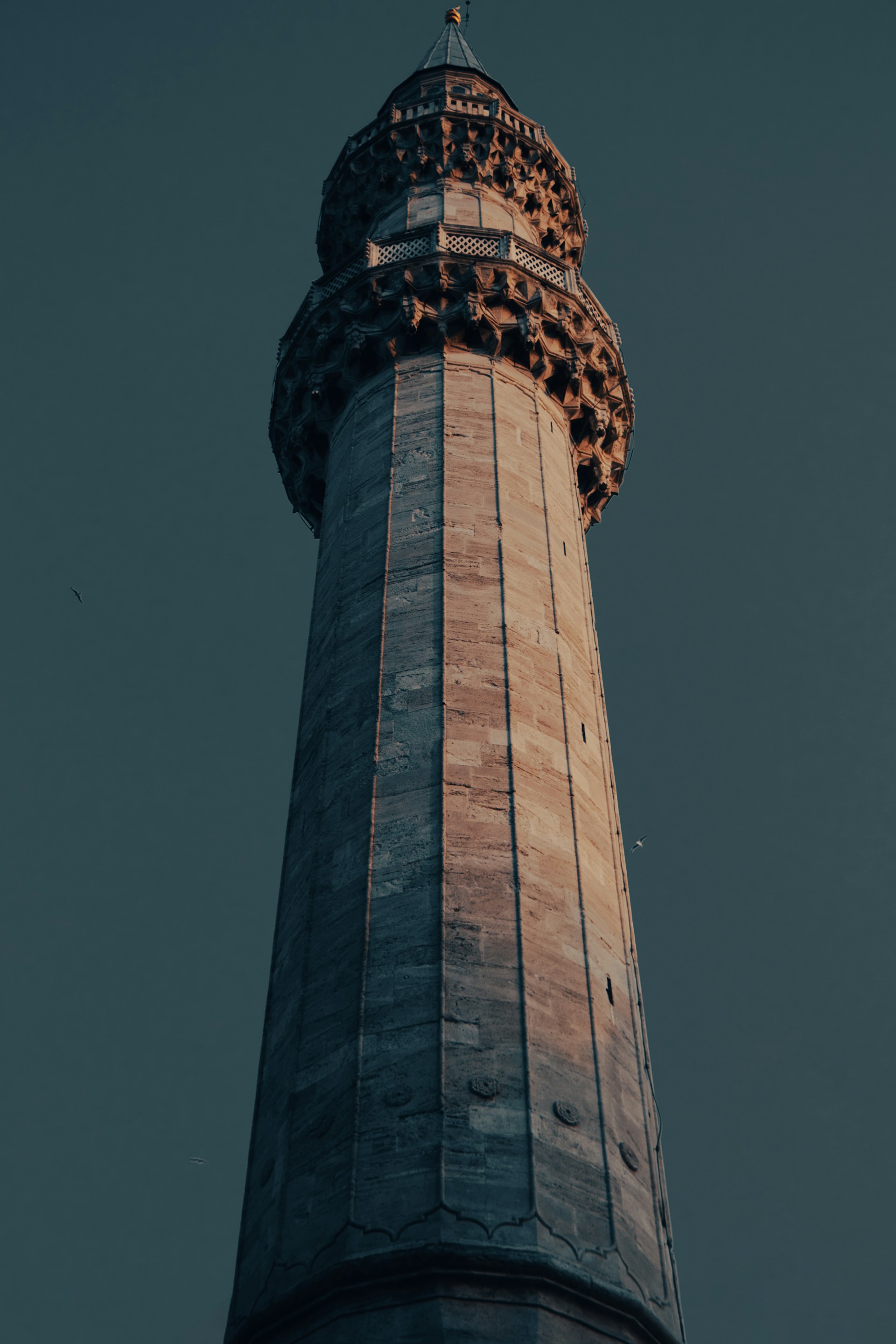 A tall tower with a clock on the top of it