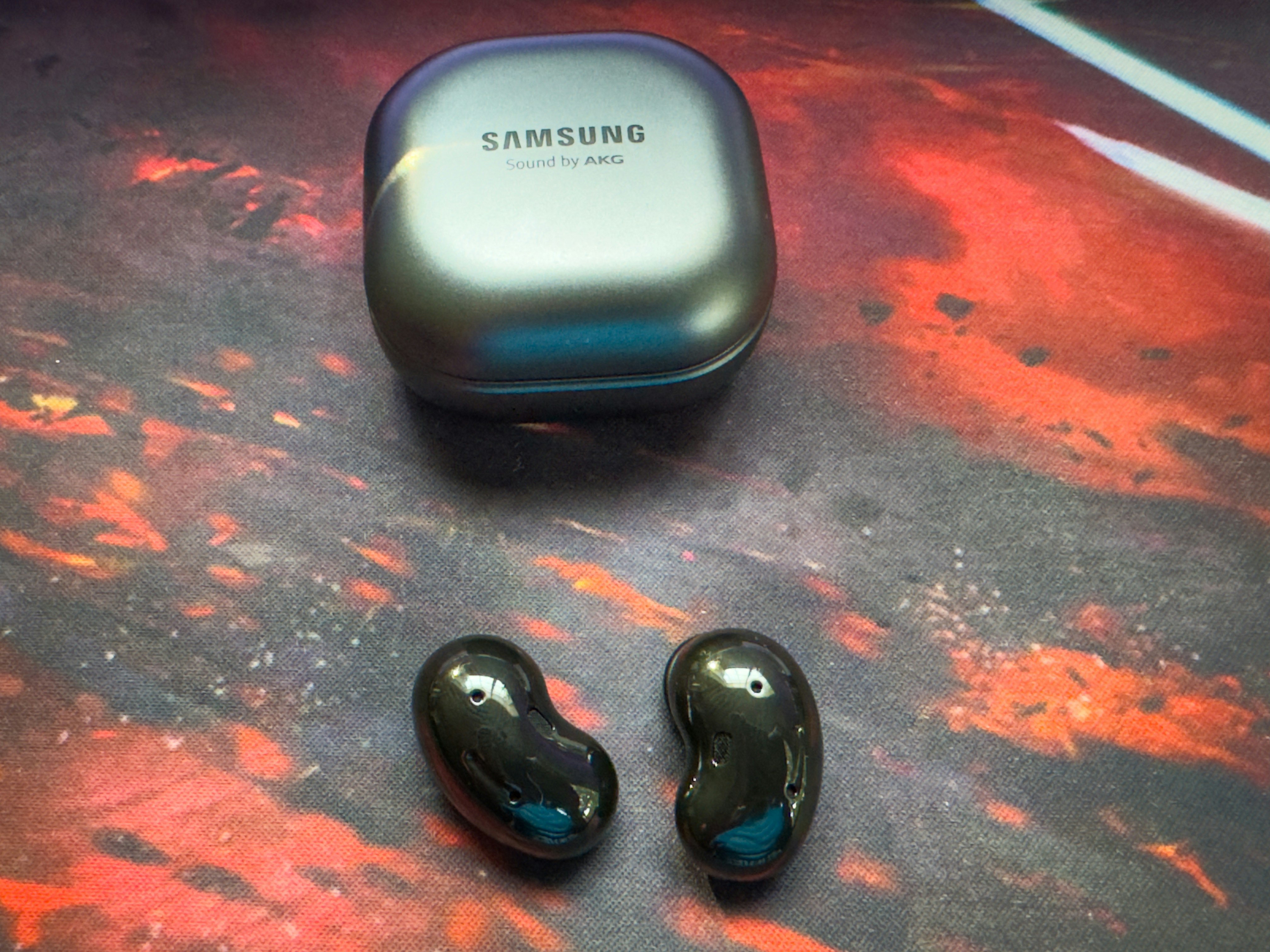 Samsung Galaxy Buds3 Pro earbuds in case on dark background