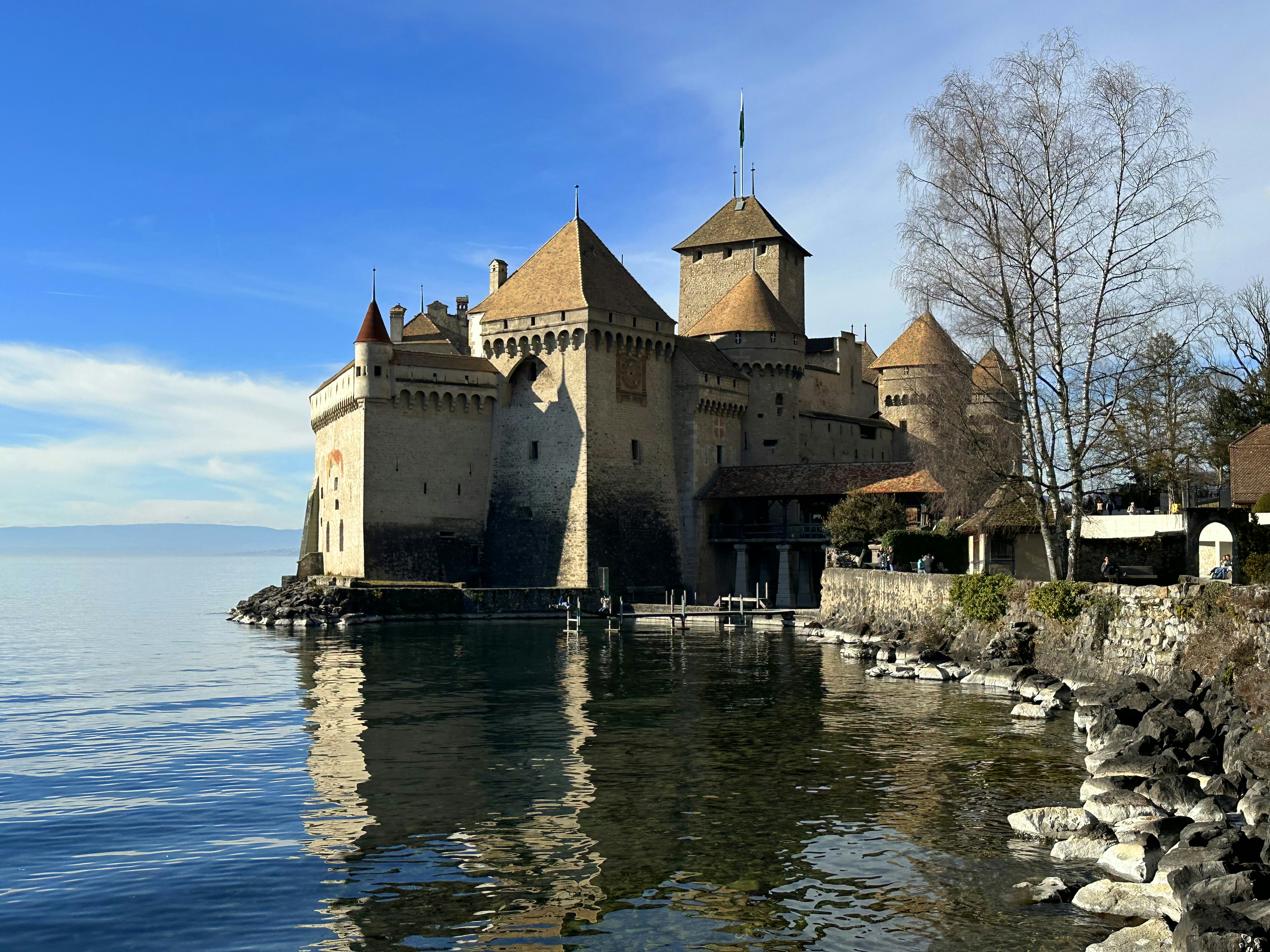 A large castle sitting on top of a lake