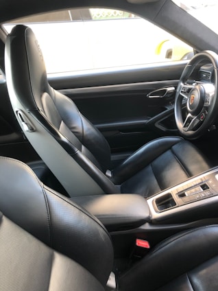 The interior of a car with black leather seats