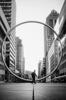 A man standing in the middle of a city
