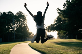A person jumping in the air on a skateboard