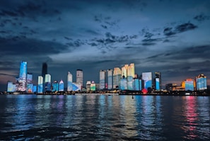 A large body of water with a city in the background