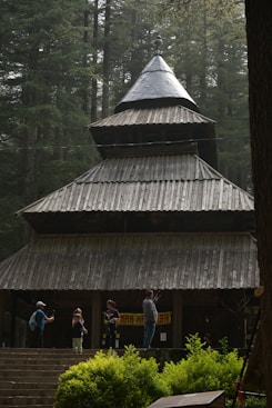 A group of people standing outside of a building