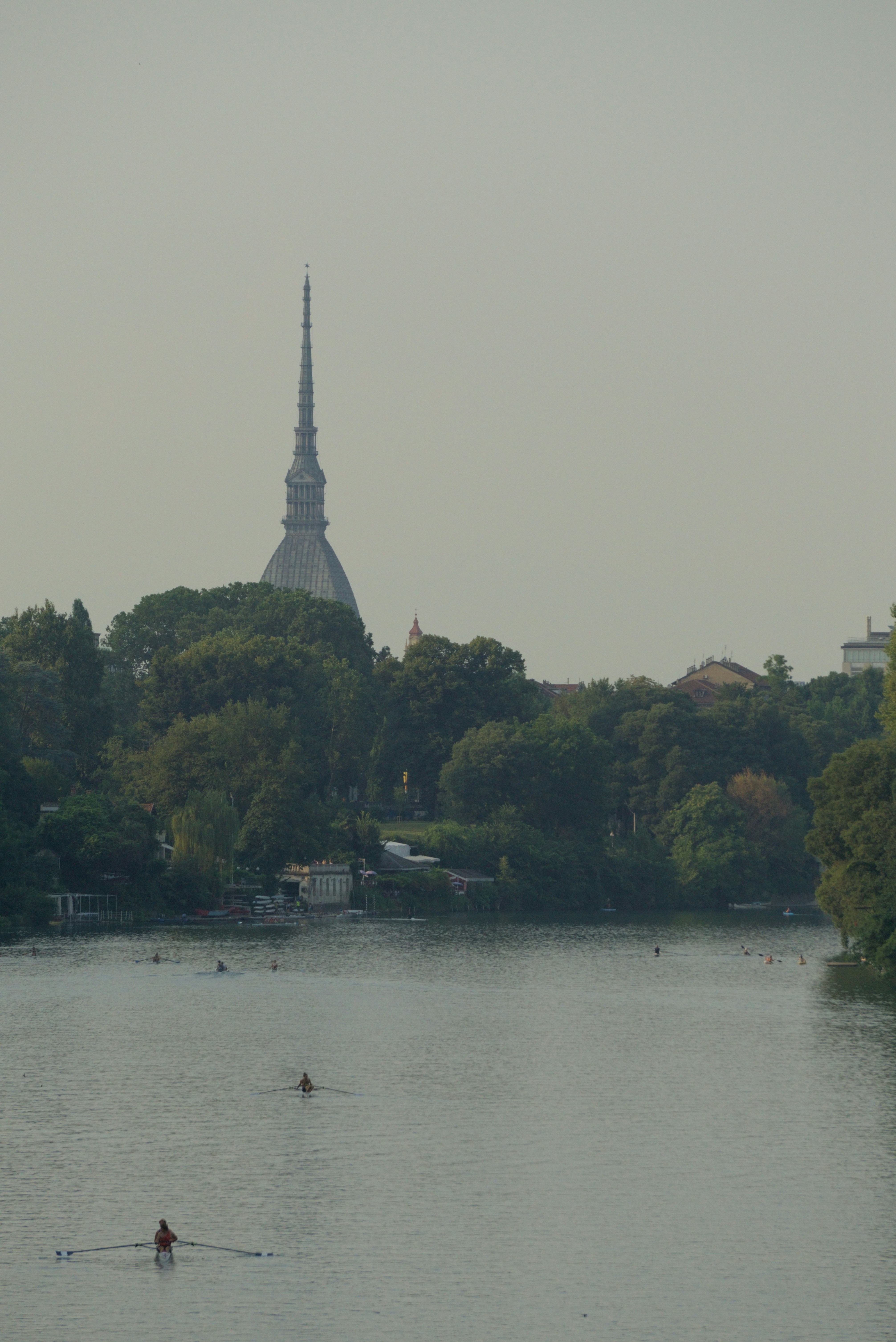 A body of water with a tower in the background