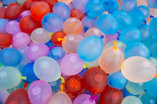 A bunch of balloons that are all different colors