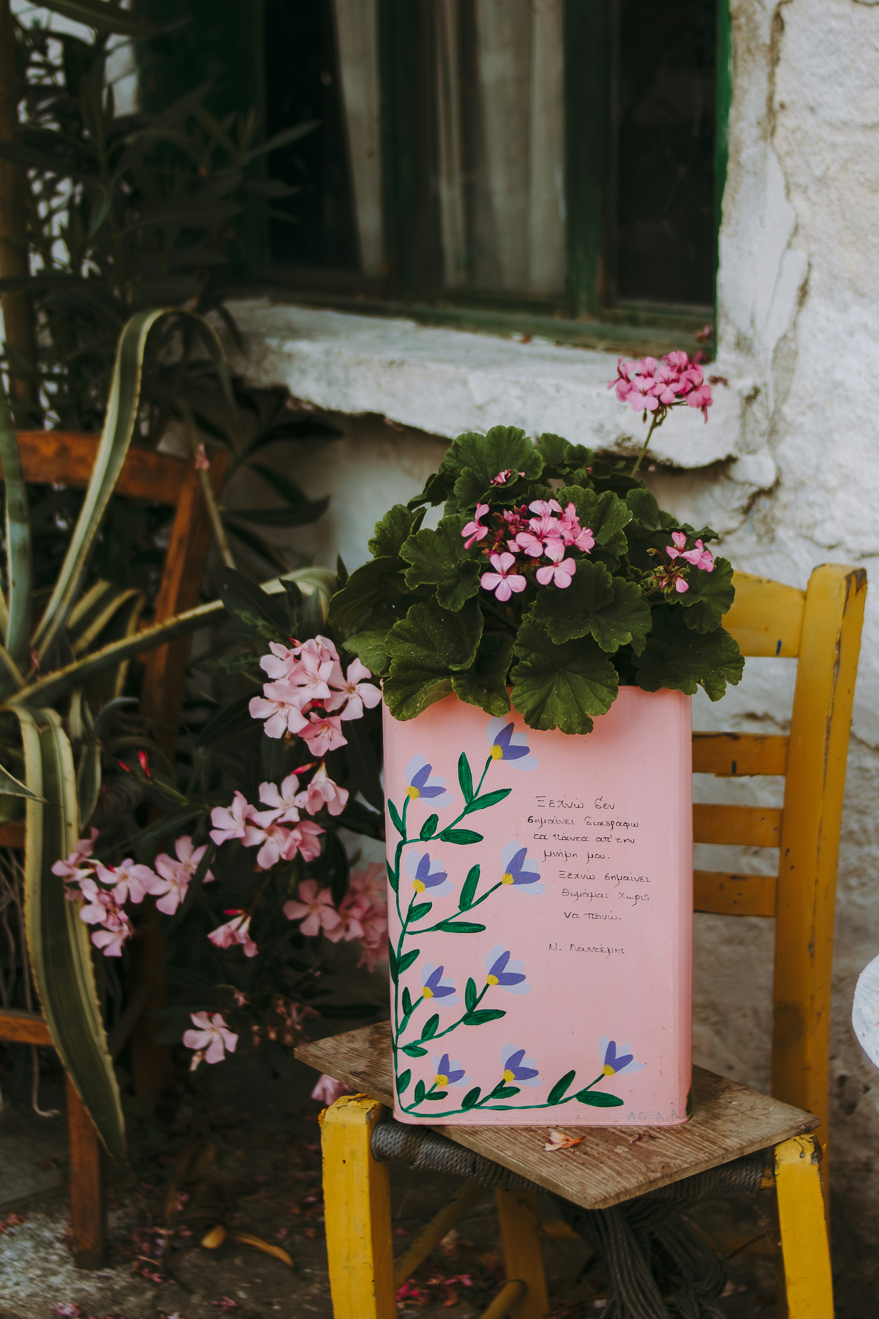 A pink bag sitting on top of a wooden chair