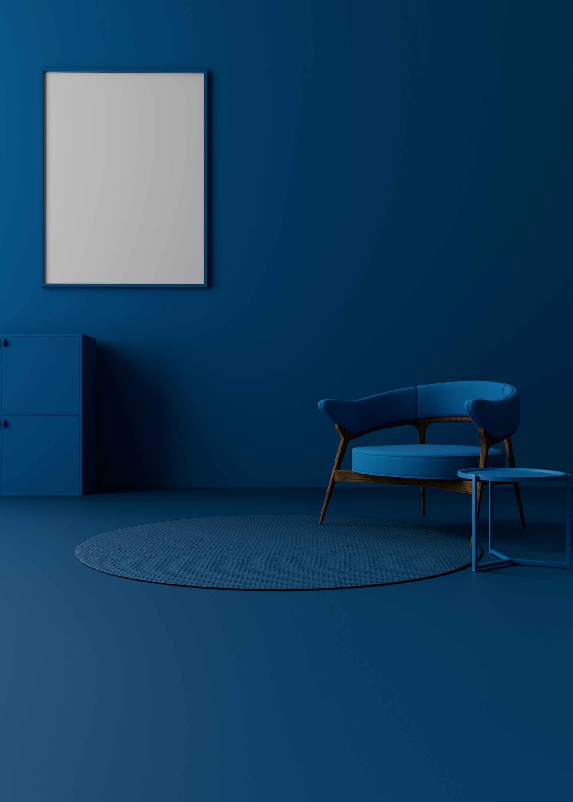A blue room with a chair and a picture frame