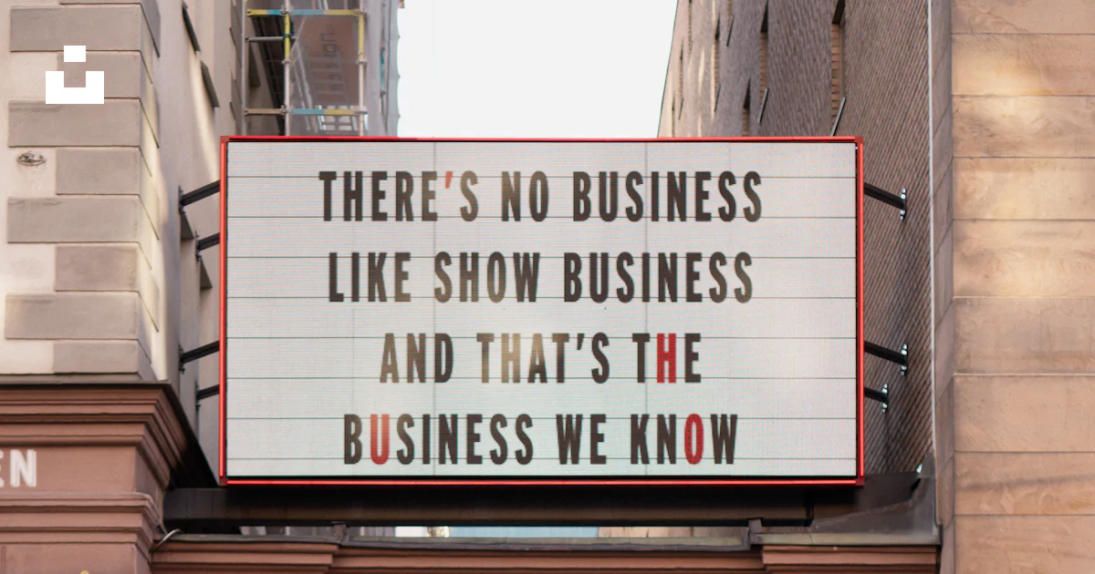 A sign that says there's no business like show business and that's ...