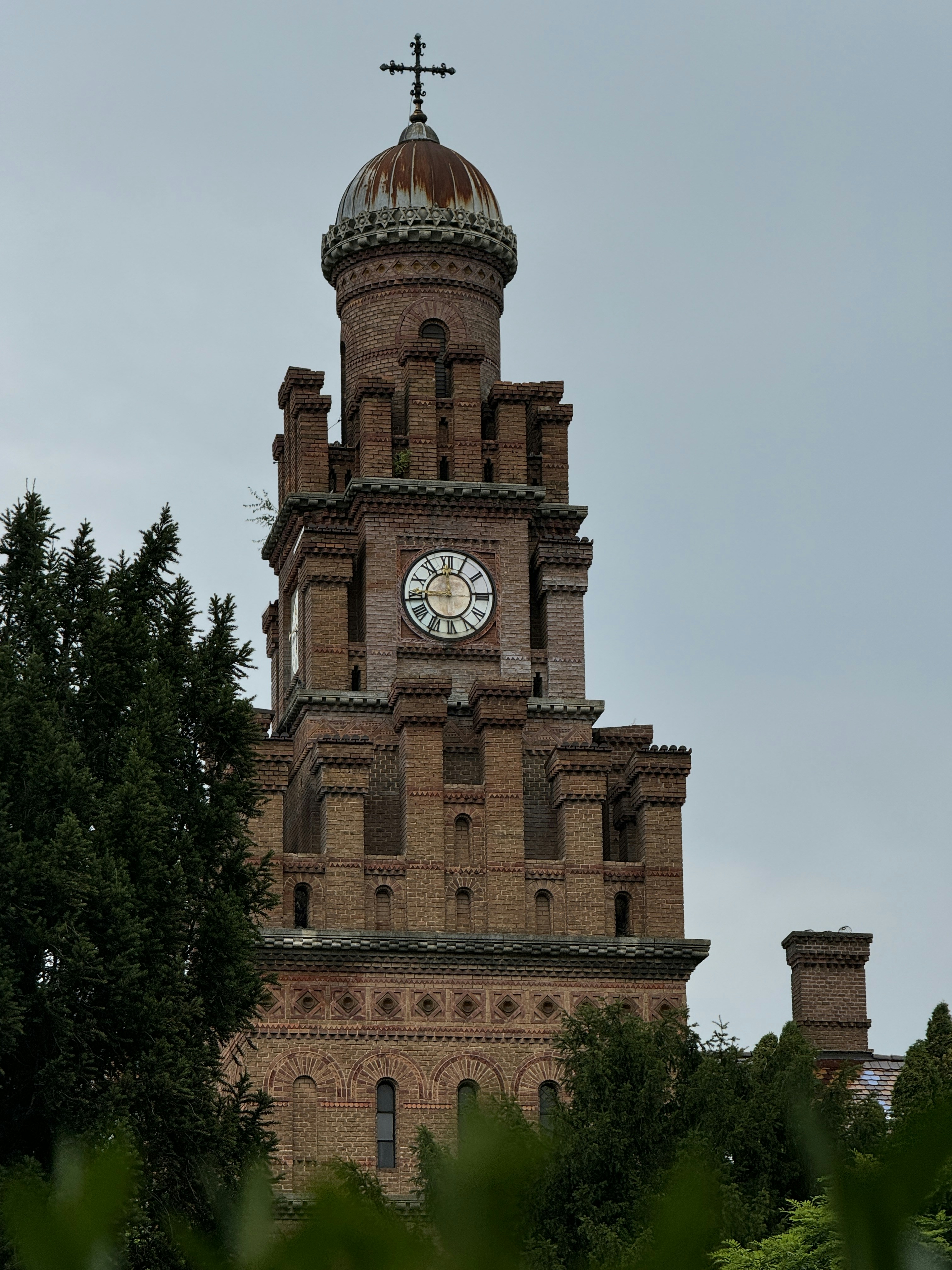 A tall tower with a clock on the top of it