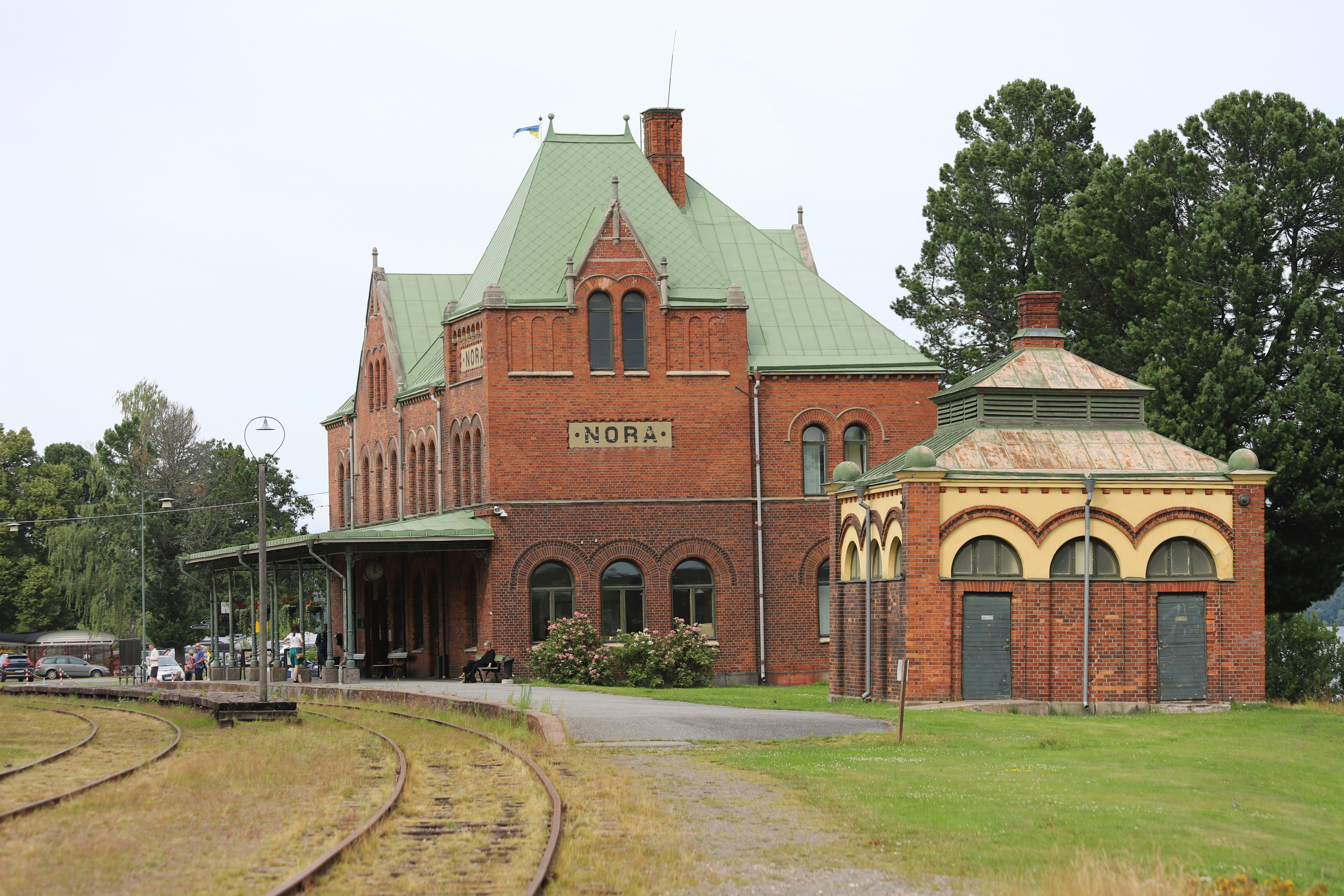 A train station with a train on the tracks