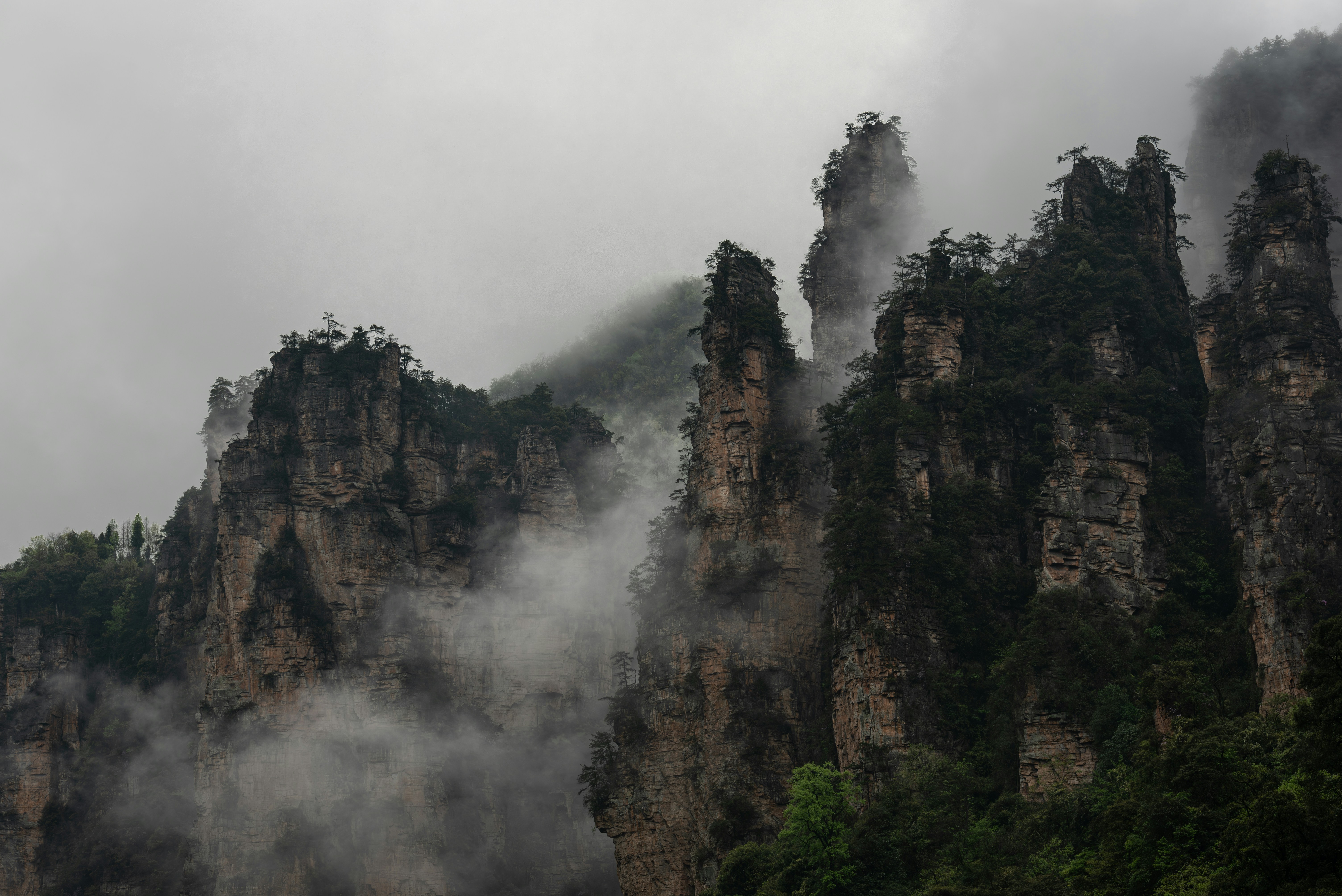 A mountain covered in fog and steam