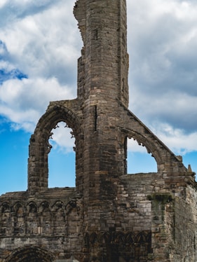 An old stone building with a clock tower