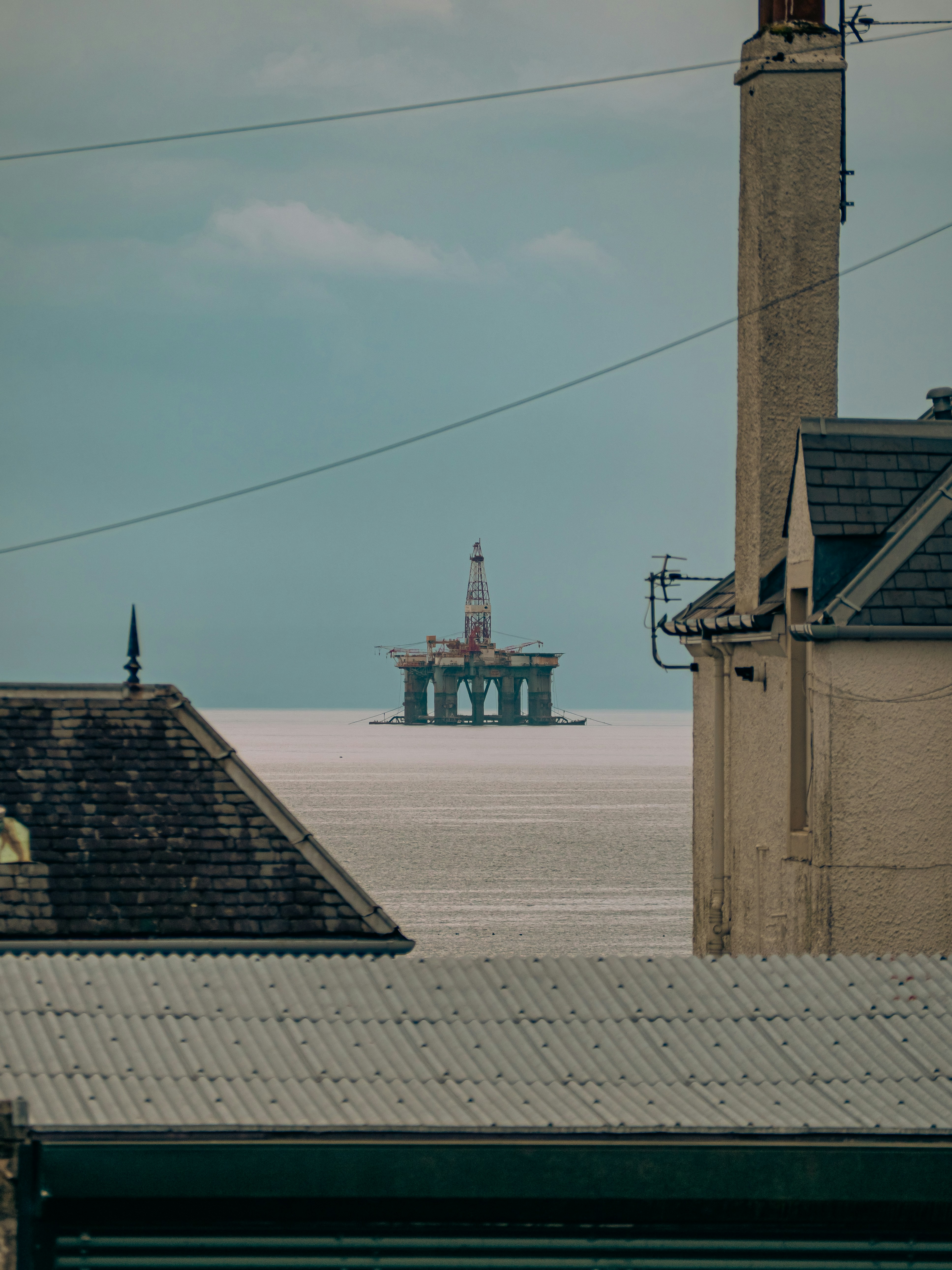A view of the ocean from a rooftop of a building