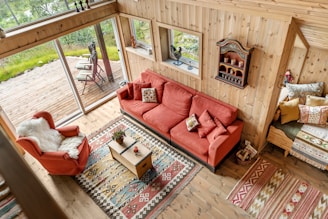 A living room filled with furniture and lots of windows