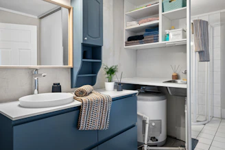 A bathroom with a sink and a shower