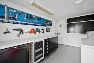 A garage with a lot of tools on the wall