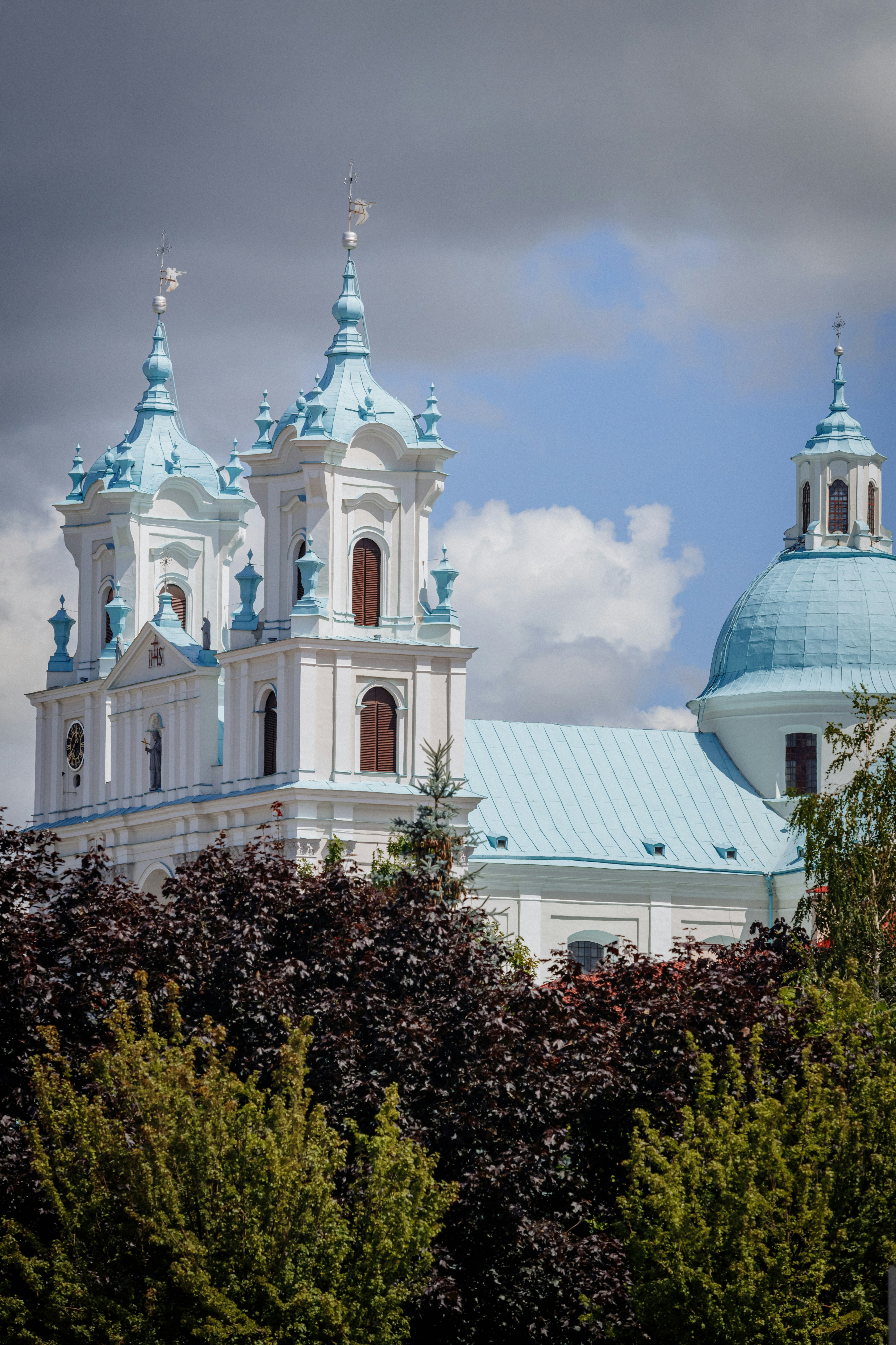 A large white building with a blue roof