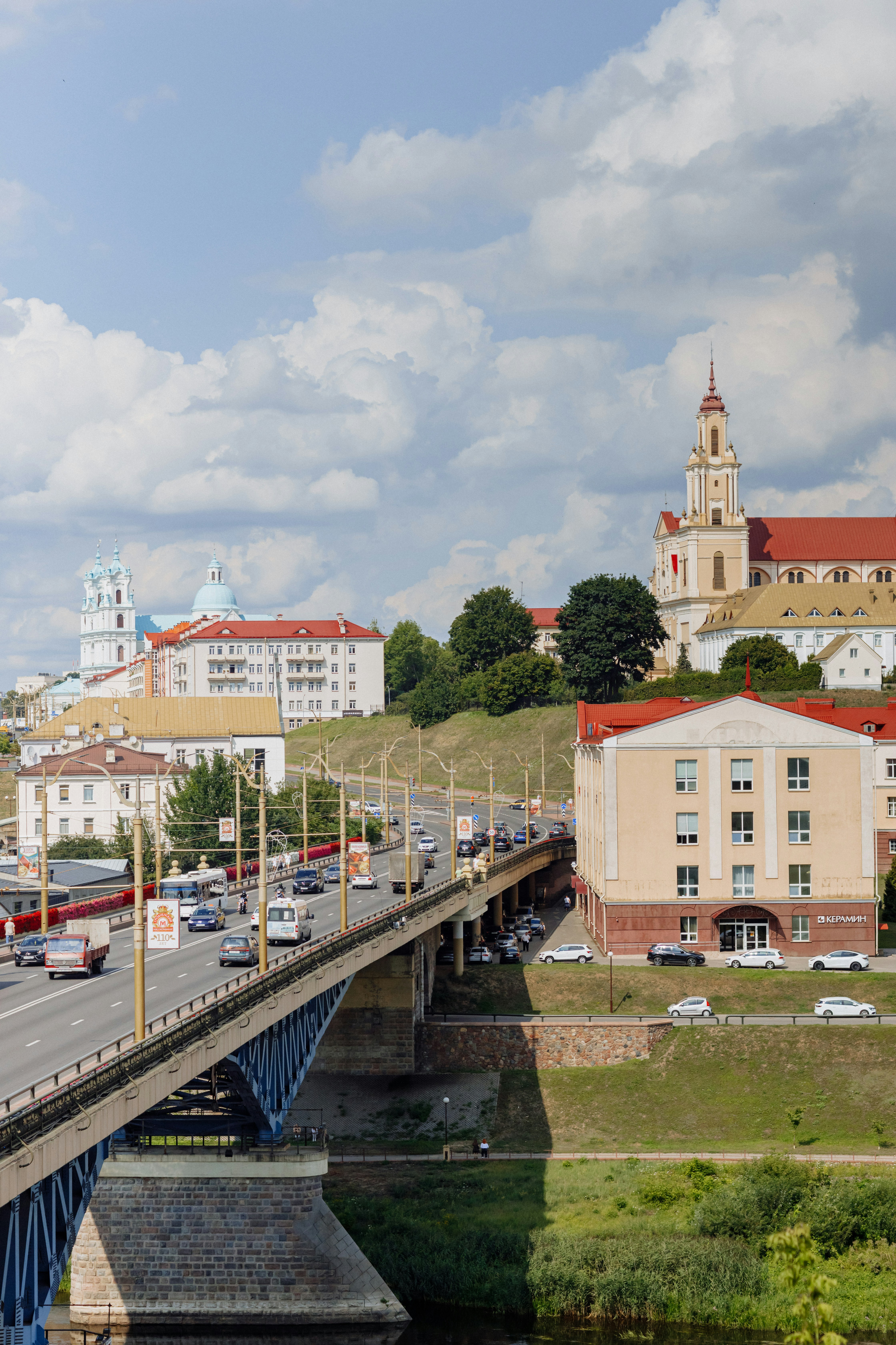A bridge over a river with cars driving on it