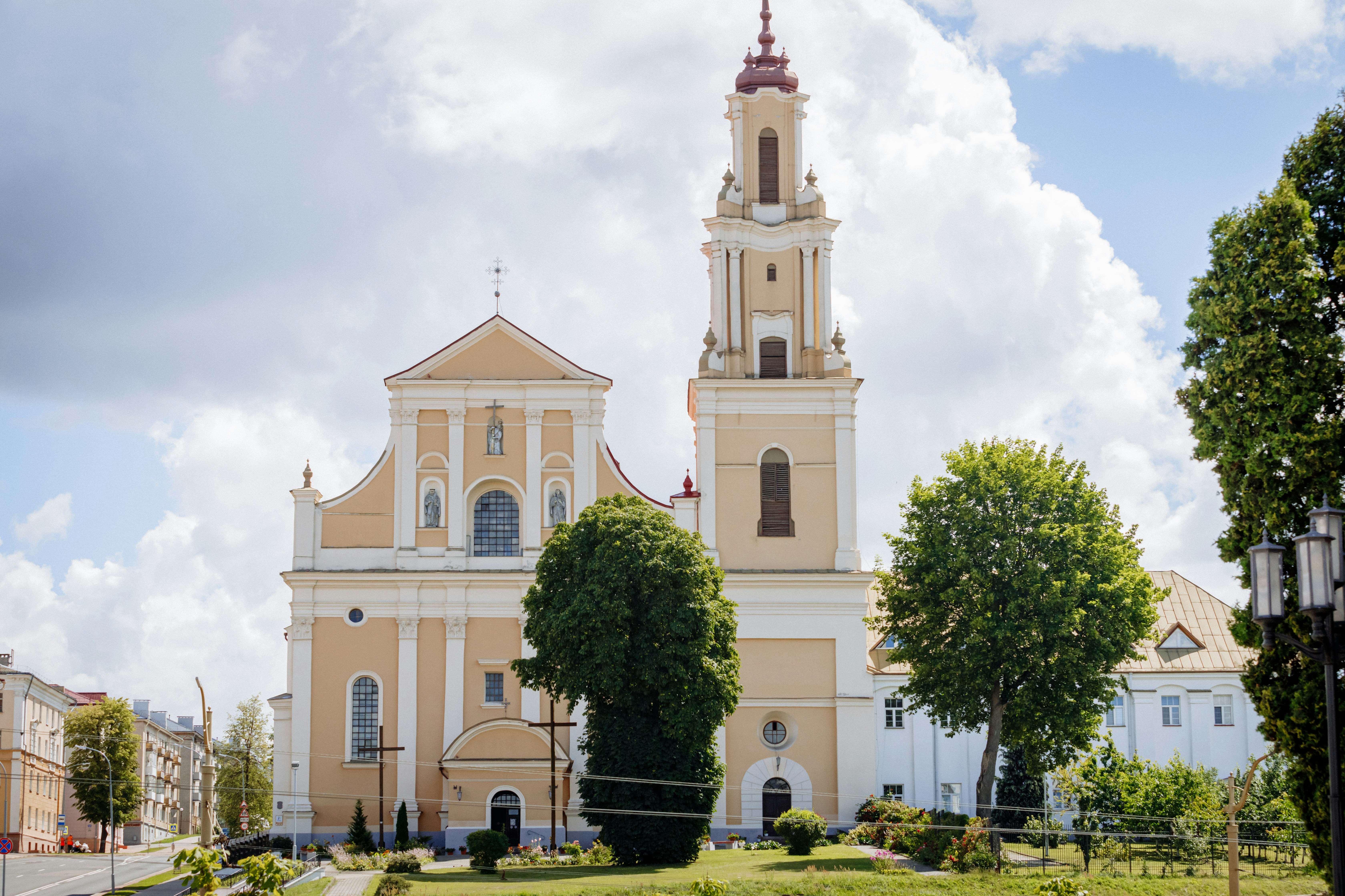 A church with a steeple on a cloudy day