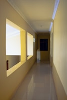 A long hallway with a mirror on the wall