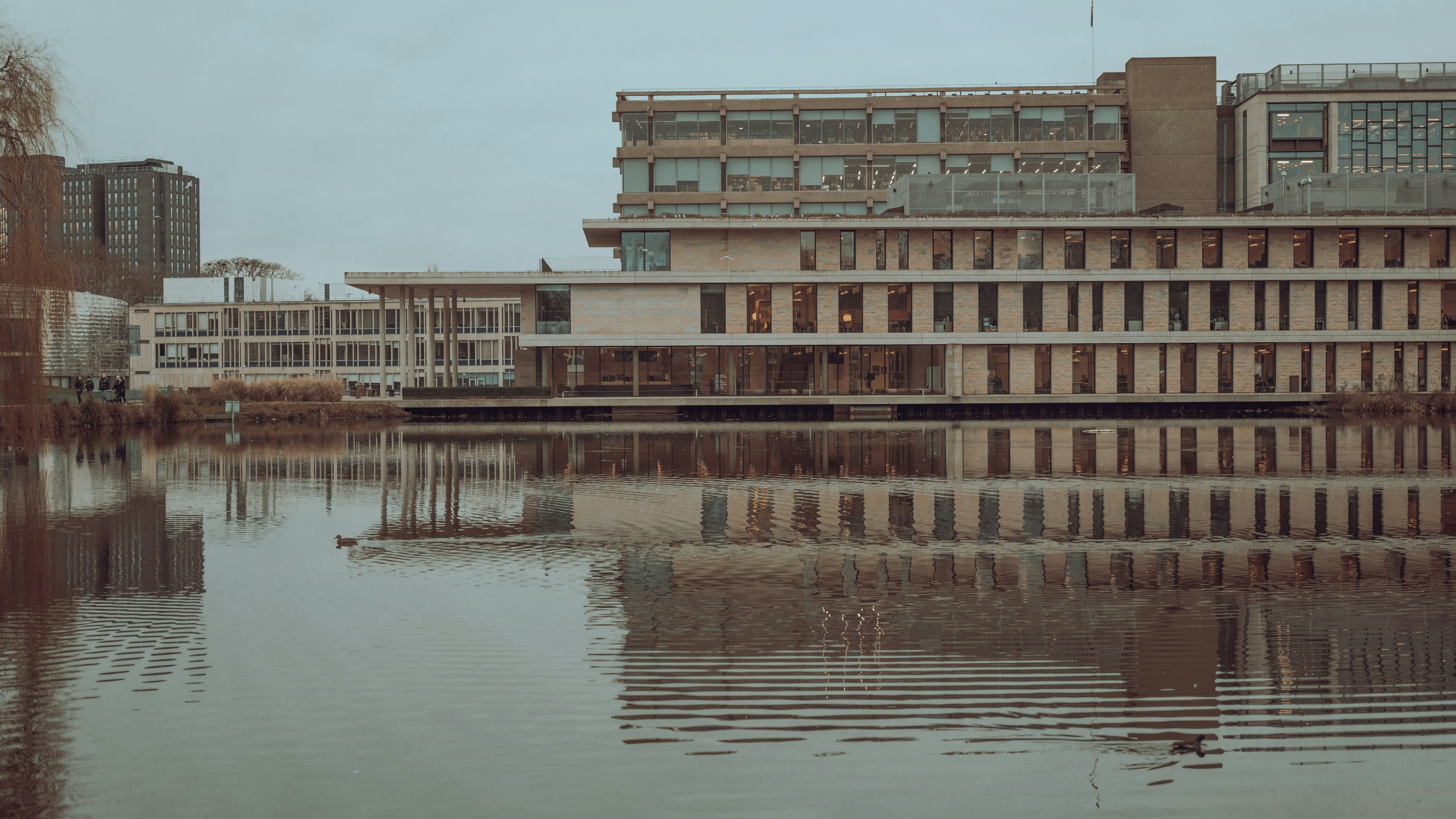 A large building sitting next to a body of water