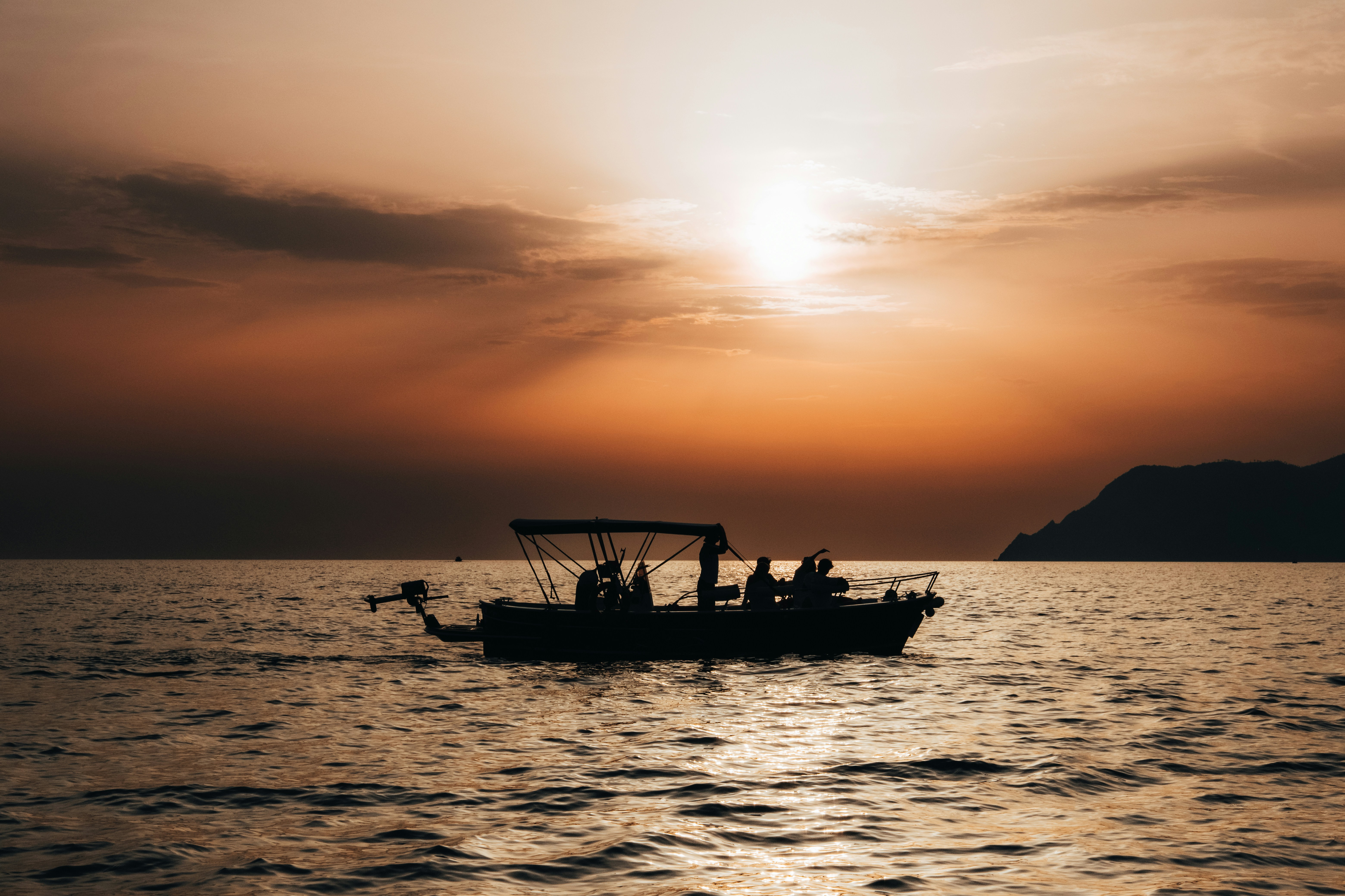 A boat floating on top of a large body of water