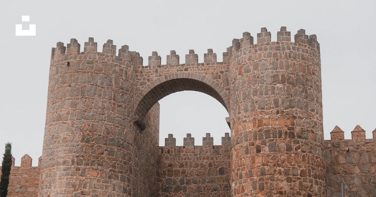 Large Gate Castle A large brick castle with a gate and steps leading to it photo – Free ...