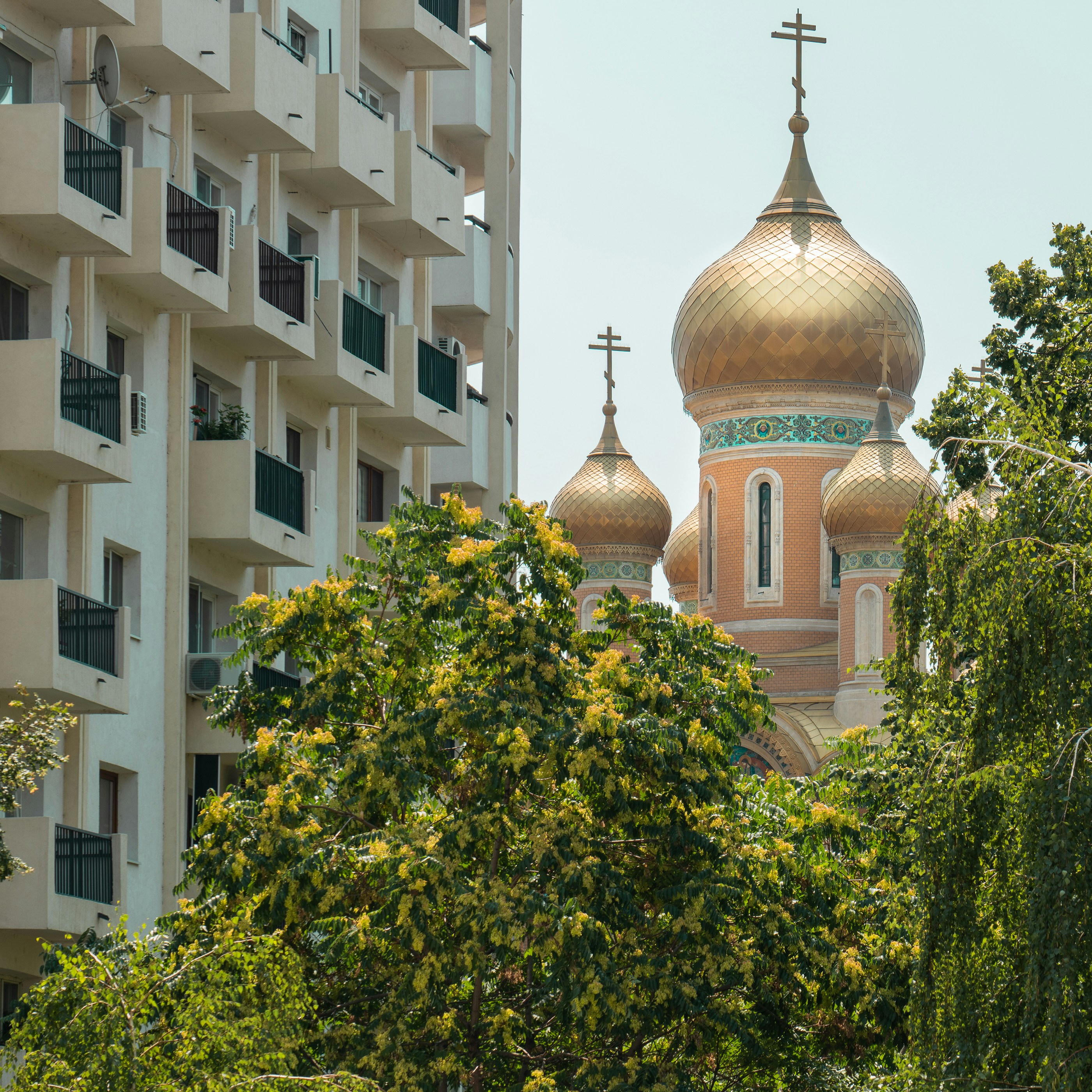 A building with a golden dome and a cross on top