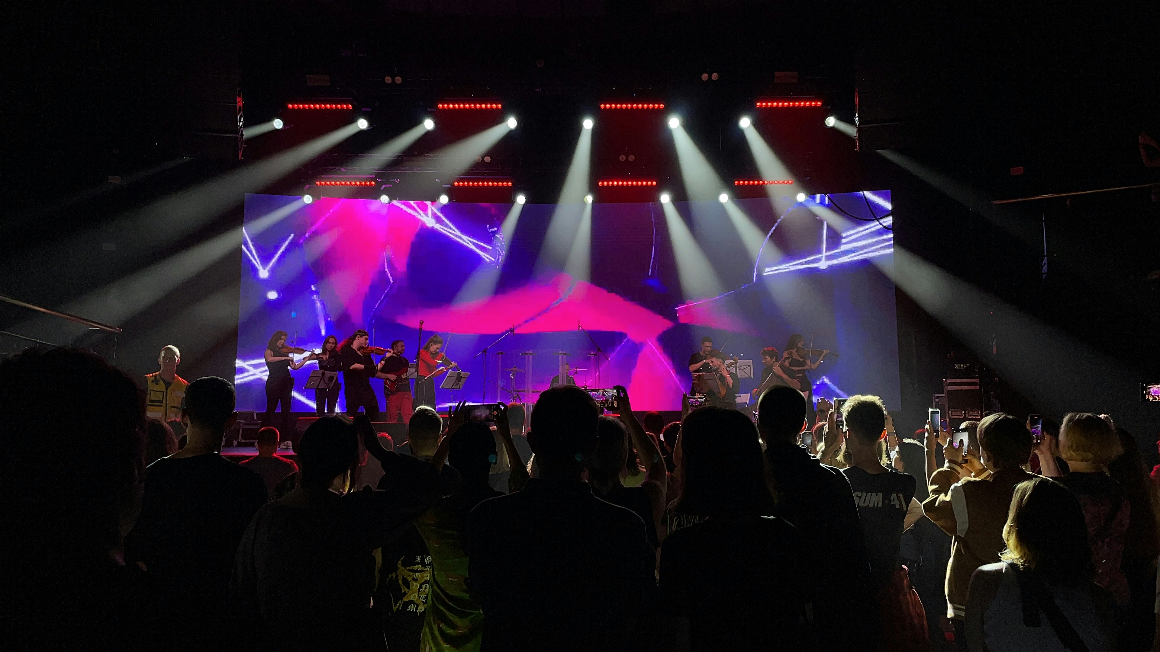 A group of people standing on top of a stage