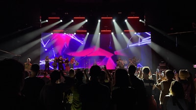 A group of people standing on top of a stage