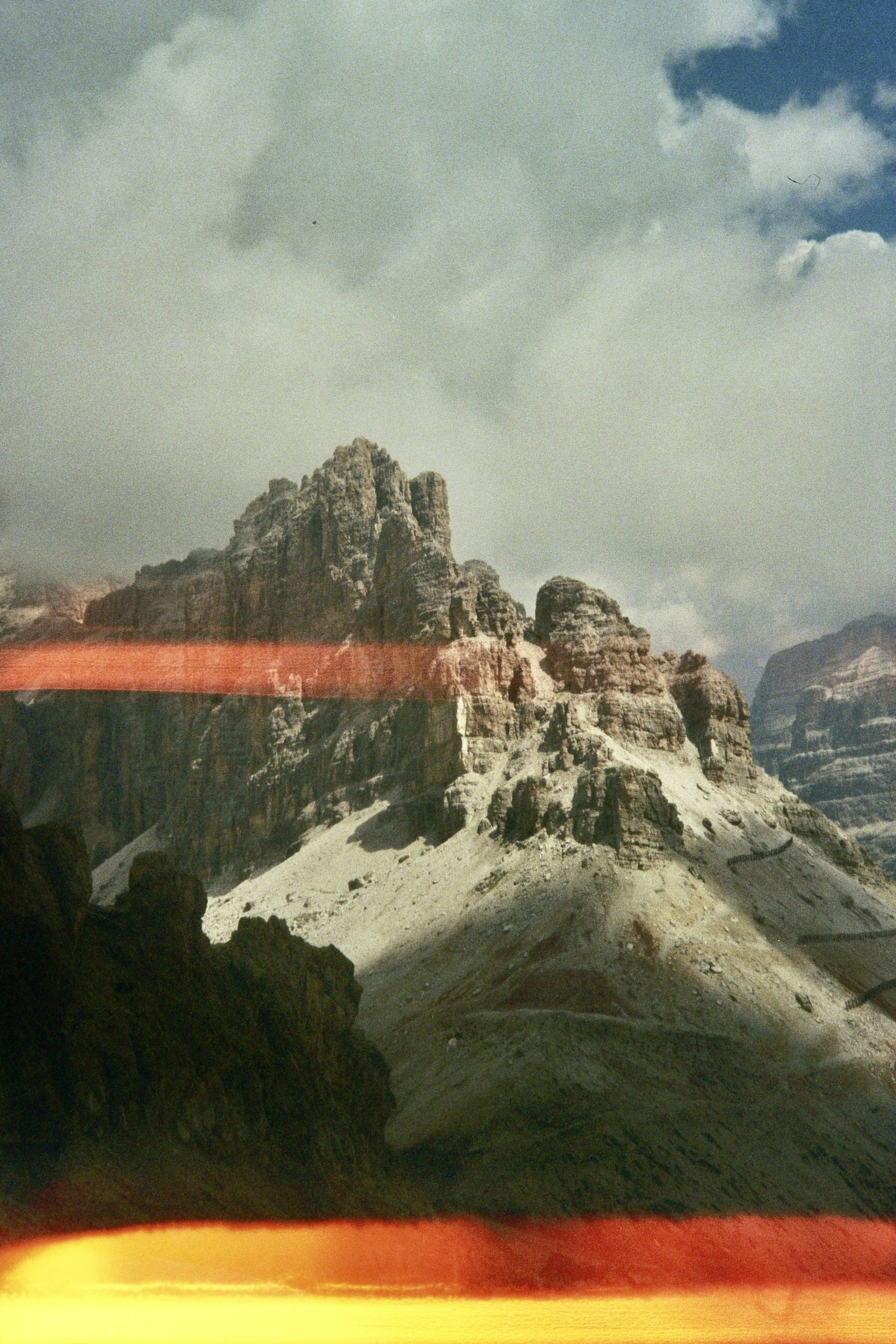A view of a mountain range from a train window