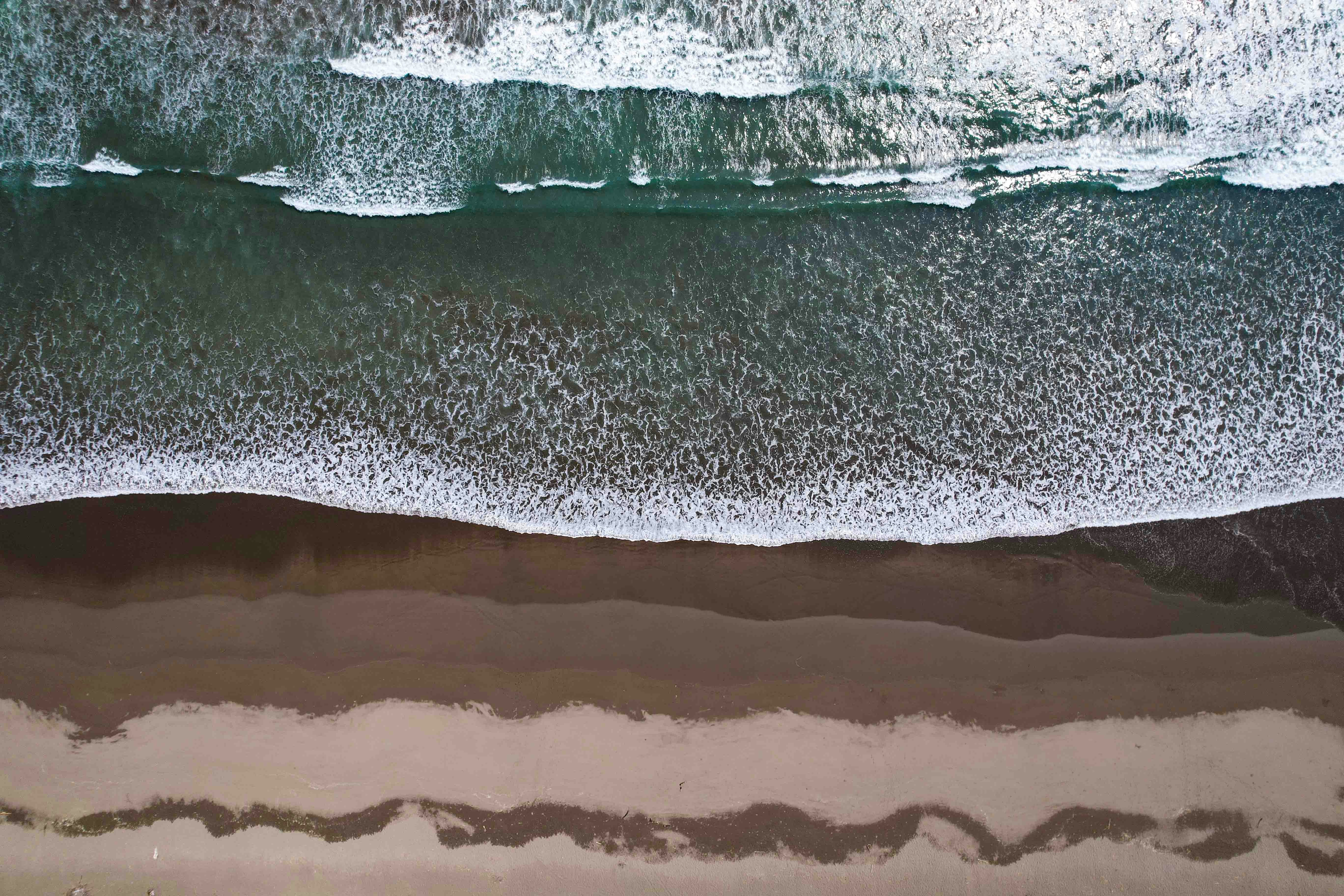 A bird's eye view of a beach and ocean