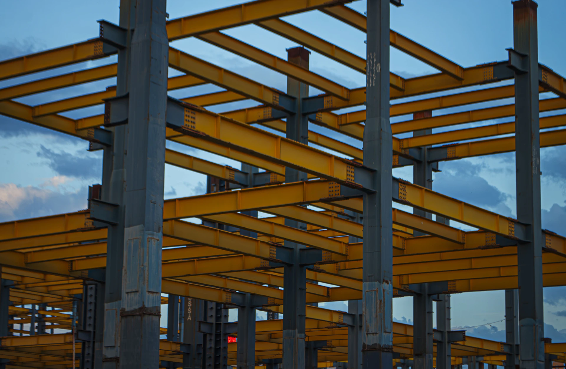 A group of wooden structures in the middle of a parking lot