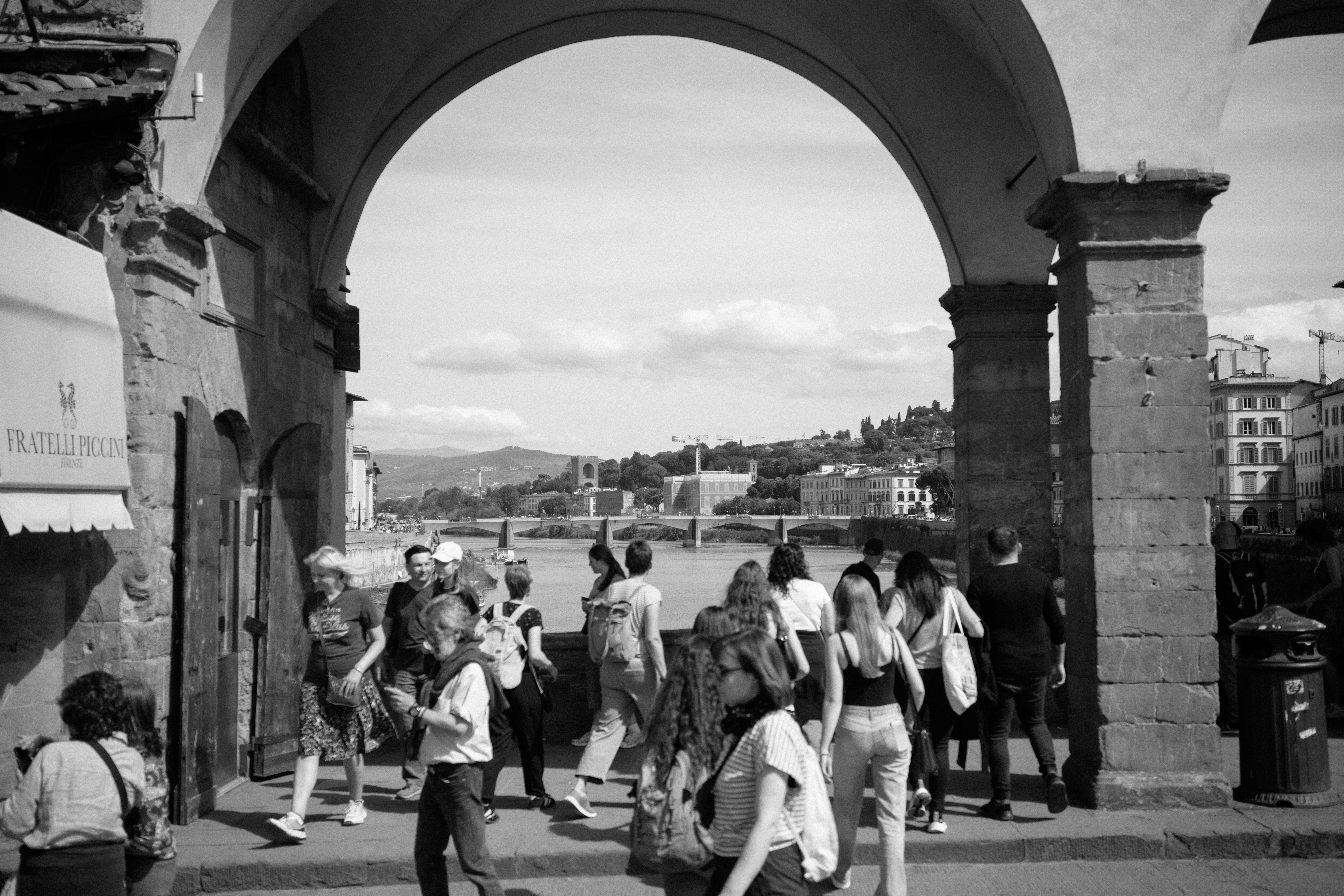 A group of people walking down a street