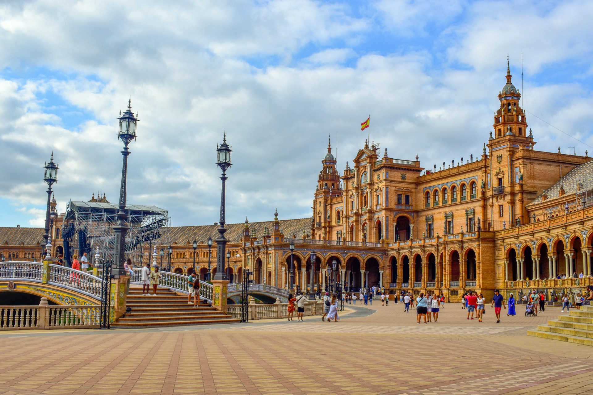 A large building with a lot of people walking around it