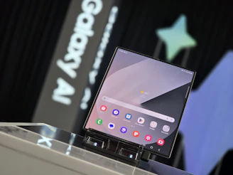 A person standing at a podium with a laptop on it