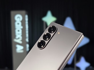 A close up of a silver cell phone