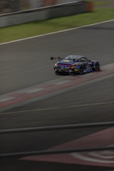 A race car driving down a race track