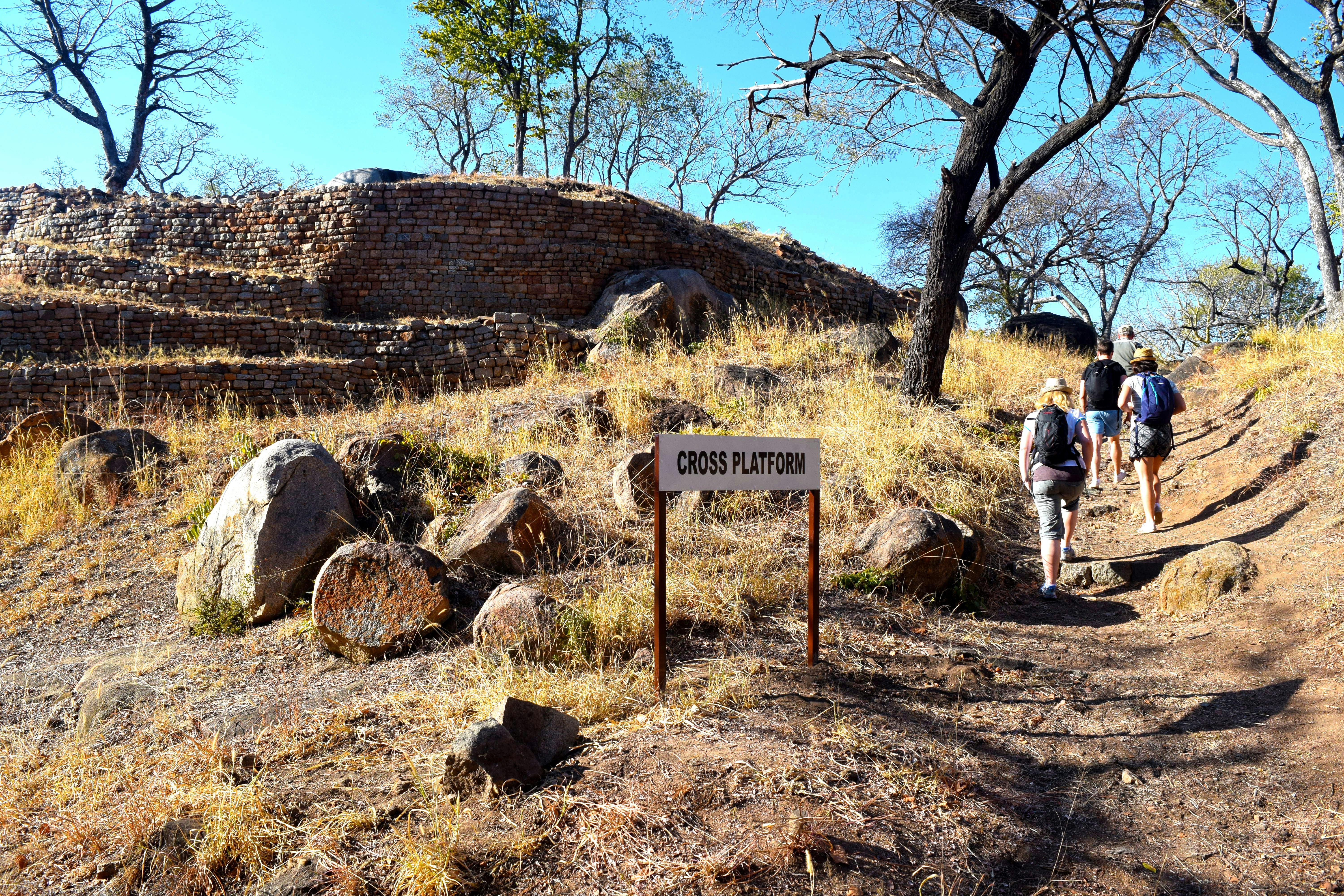 A group of people hiking up a hill