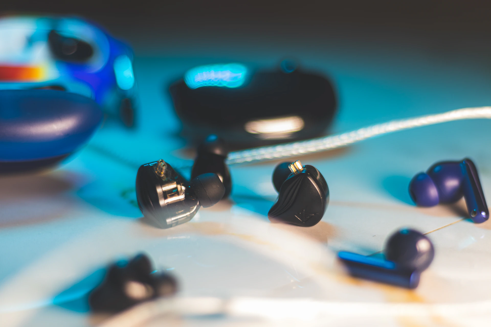 A group of ear buds laying on top of a table