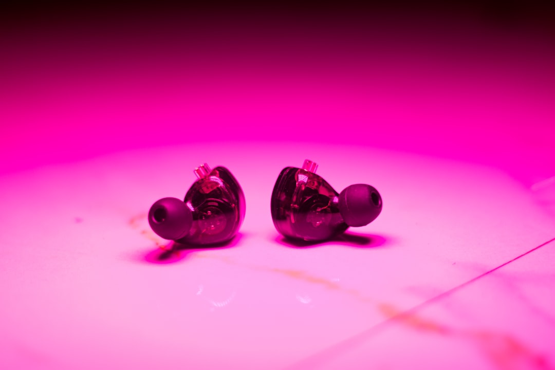 A pair of ear buds sitting on top of a table,