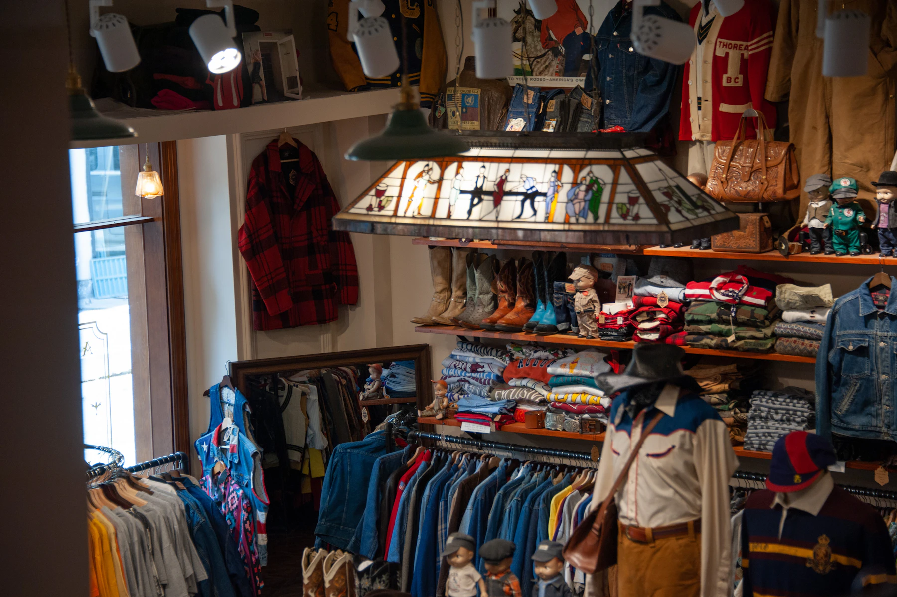 A clothing store with a lot of clothes on display