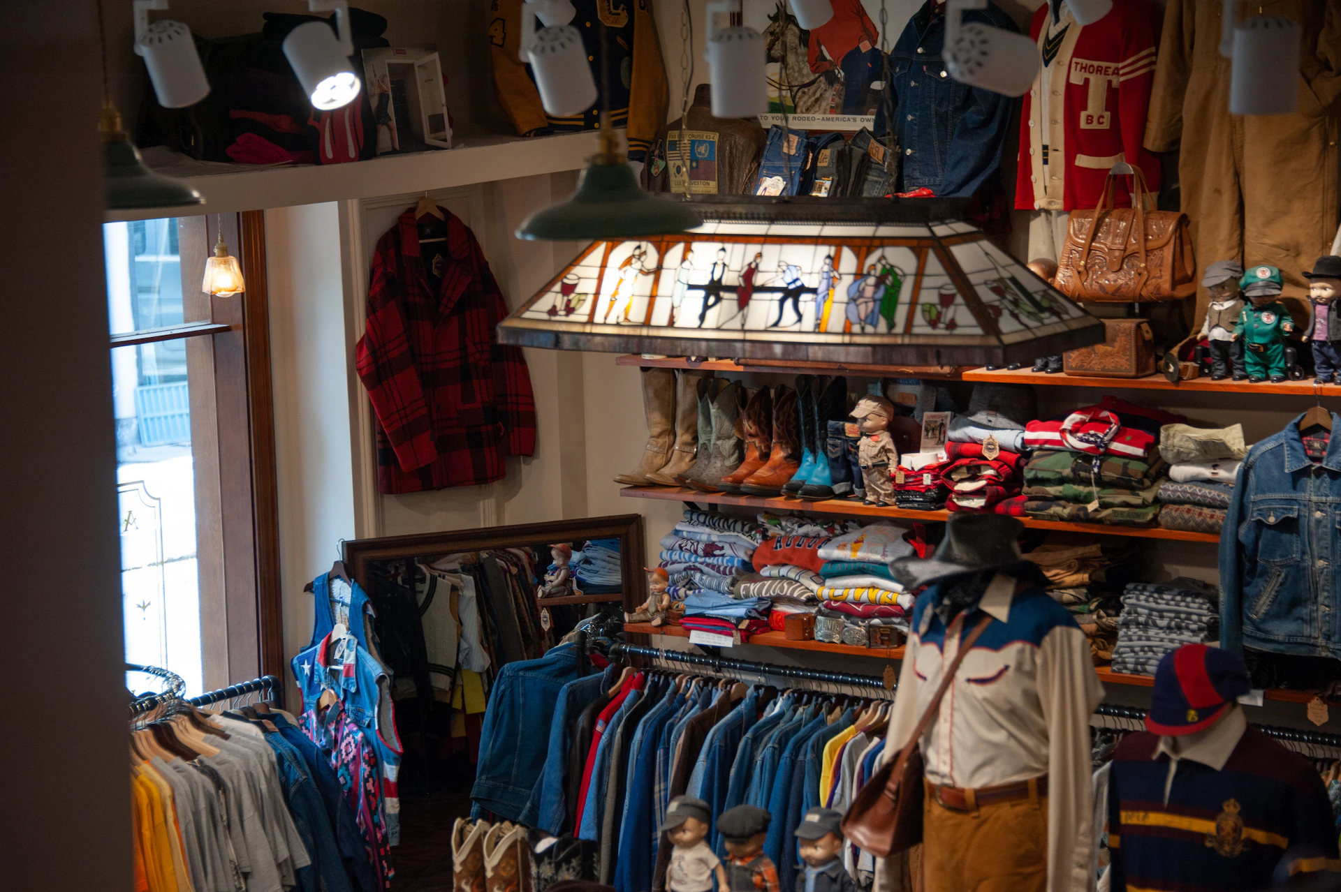 A clothing store with a lot of clothes on display