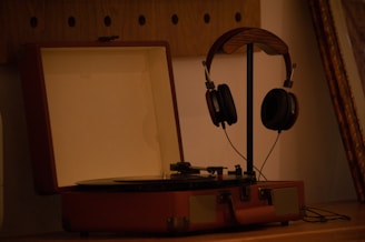 A turntable with headphones on top of it