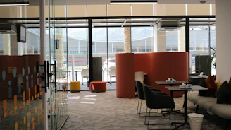 A room with a lot of chairs and tables