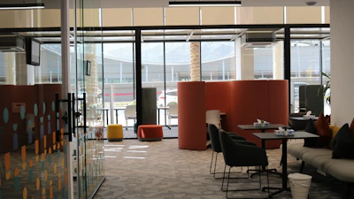 A room with a lot of chairs and tables