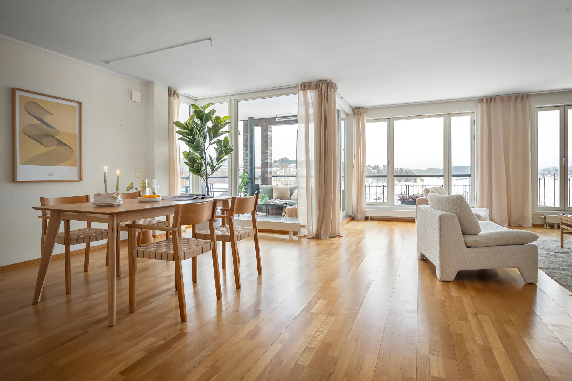 A living room filled with furniture and a wooden floor