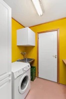A laundry room with a washer and dryer