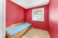 A room with a bed and a window